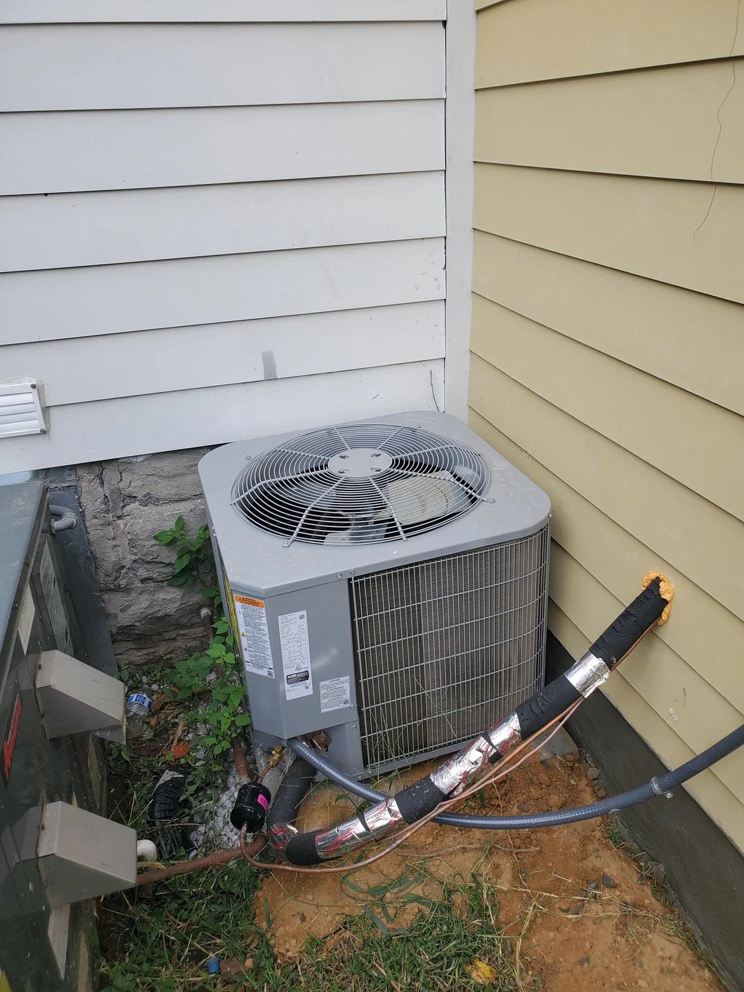 Insufficient clearance — AC unit too close to the home